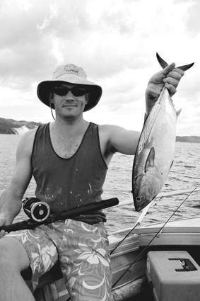 Collecting bait can also be great fun. Brett with a mack tuna destined to snapper bait.